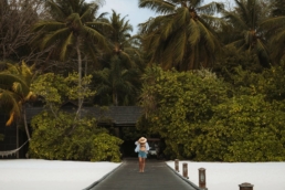 Barefoot beach walk at Villa Nautica Maldives during a solo travel escape