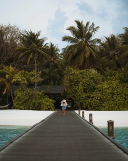 Barefoot beach walk at Villa Nautica Maldives during a solo travel escape