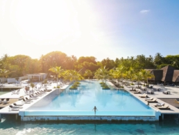 Sunrise wellness moment at Villa Nautica Maldives with waves and soft morning light