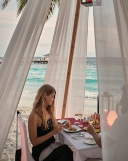 Romantic private dining setup with ocean views at Royal Island Maldives