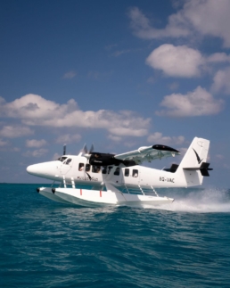 Villa Air Maldives seaplane floating on the ocean during a transfer to Villa Park