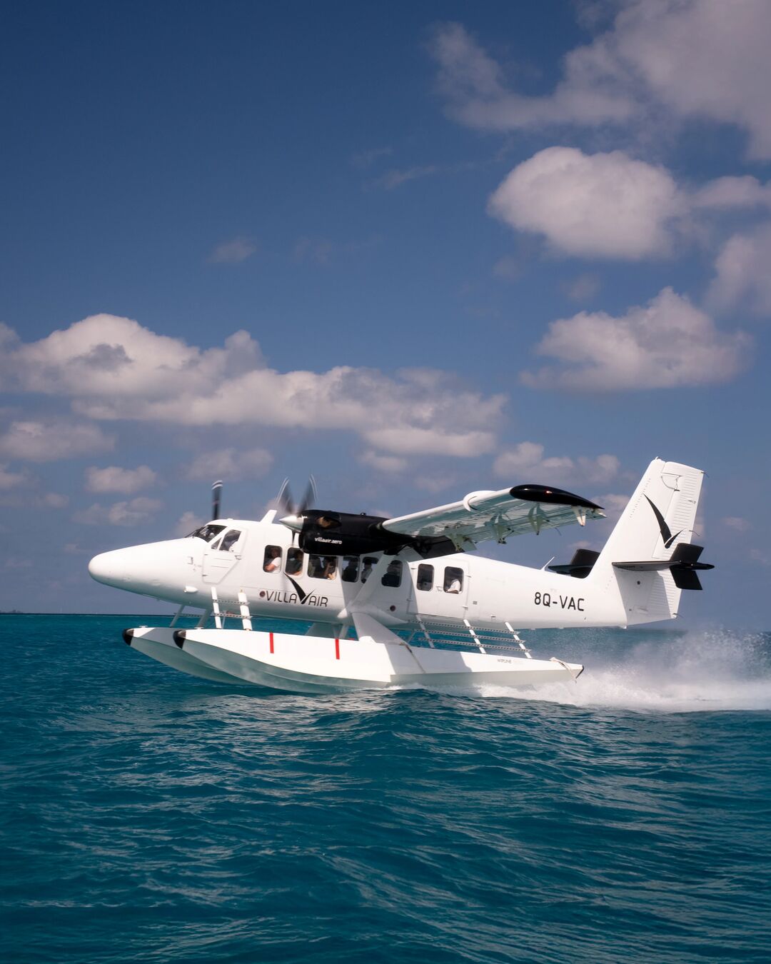 Villa Air Maldives seaplane floating on the ocean during a transfer to Villa Park